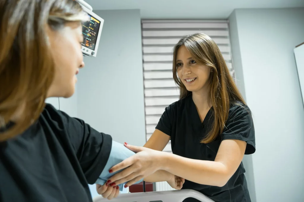 nurse taking blood pressure