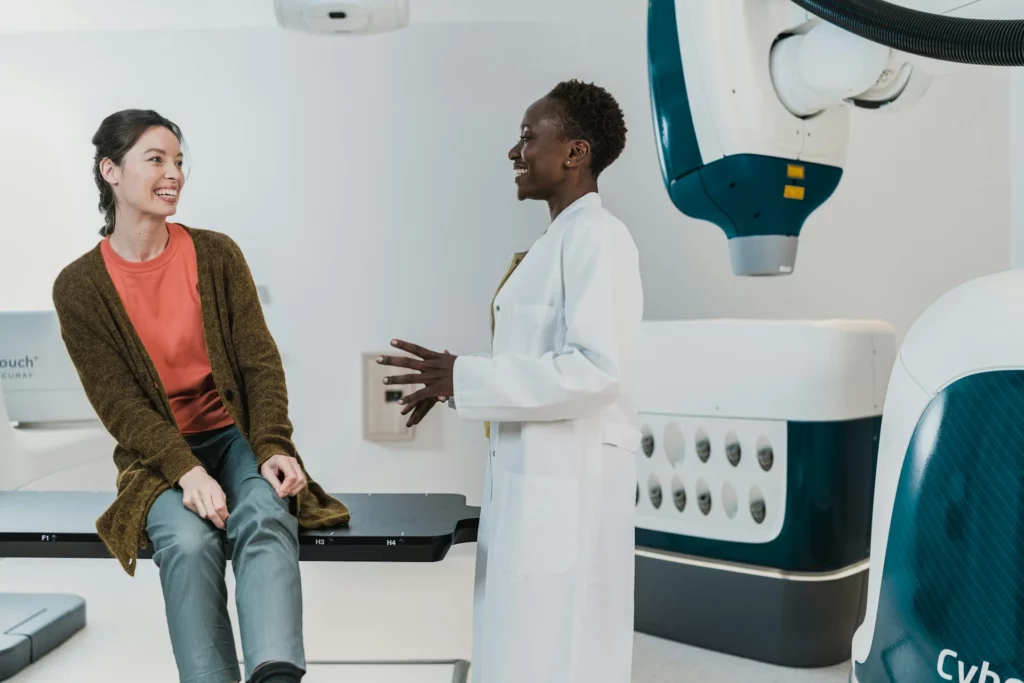 Nurse talking to patient on MRI