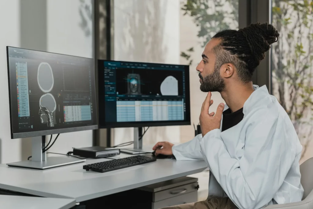 man looking at a computer