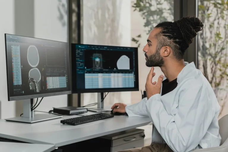 man looking at a computer