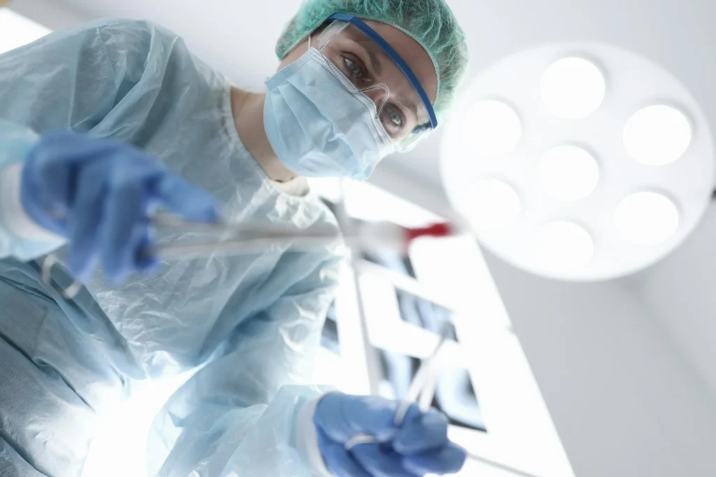 photo - a nurse working on a patient in er