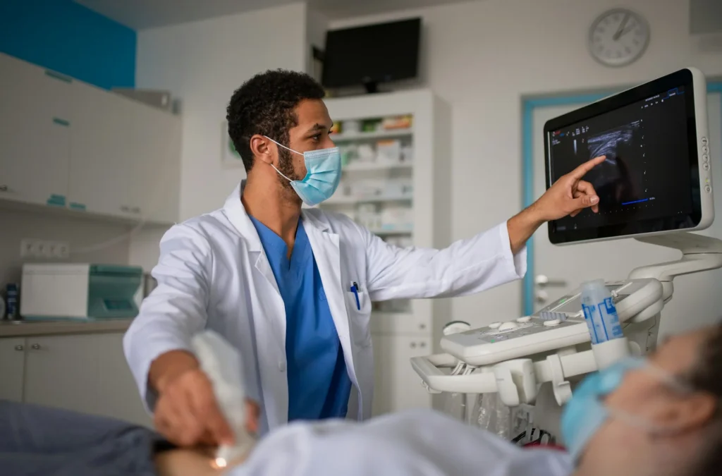 photo - a travel ultrasound tech performing procedure on a patient