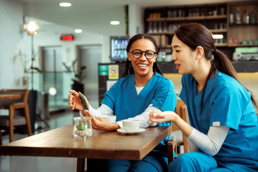 photo - two allied health professionals discussing allied health recruitment